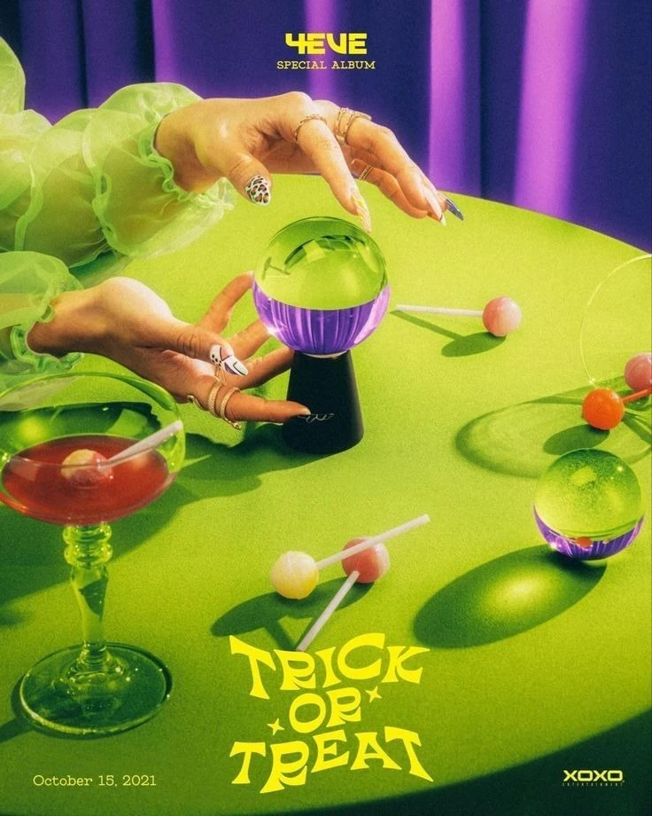 Crystal Ball and Hands on Chartreuse Table