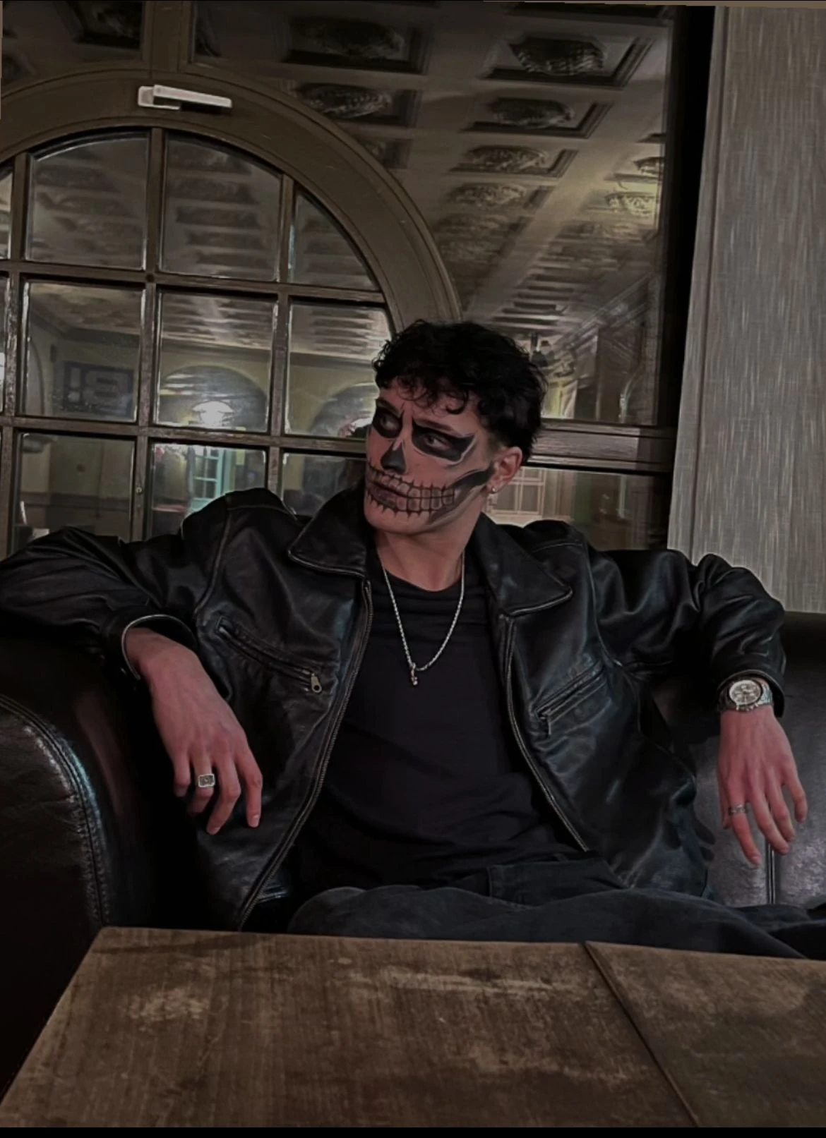 Skull makeup in a leather jacket