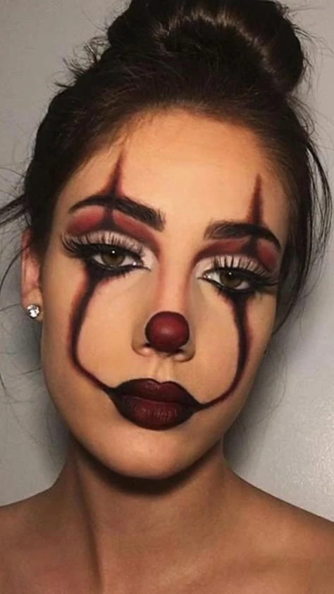 Clown with black tears and a red nose