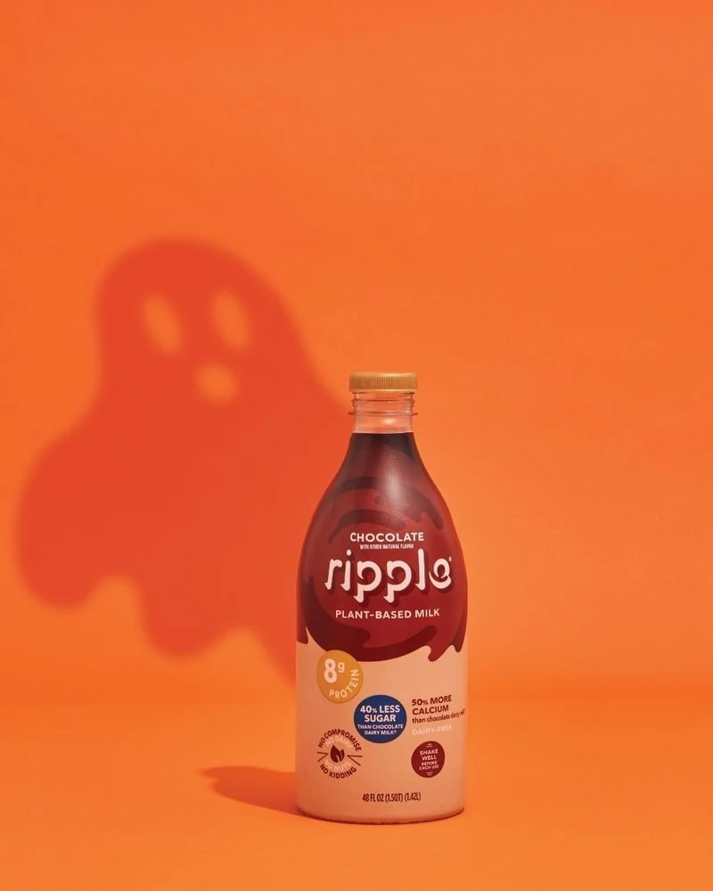 Ghost Shadow Cast Behind a Chocolate Milk Bottle