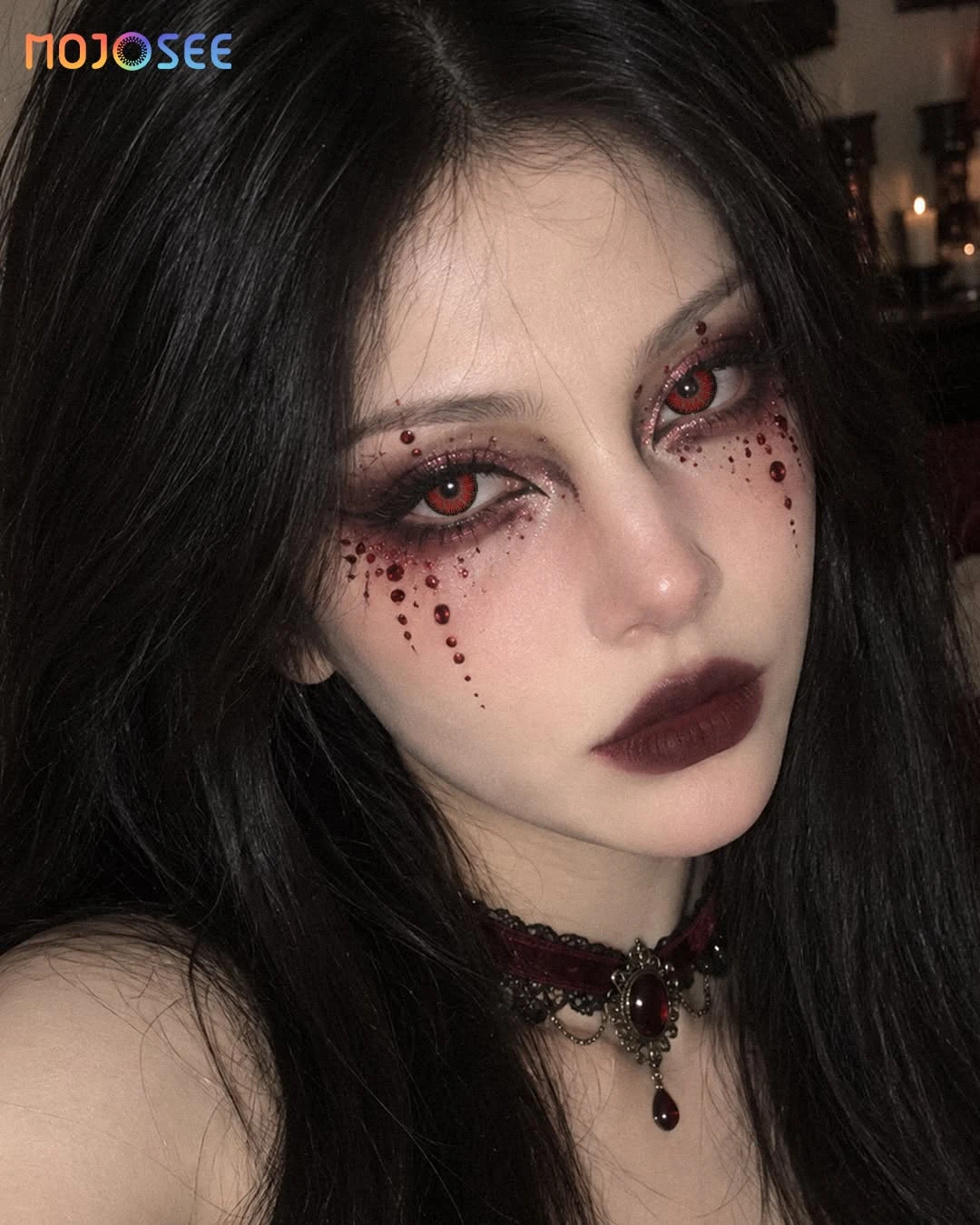 Vampire with smudged liner and blood lashes