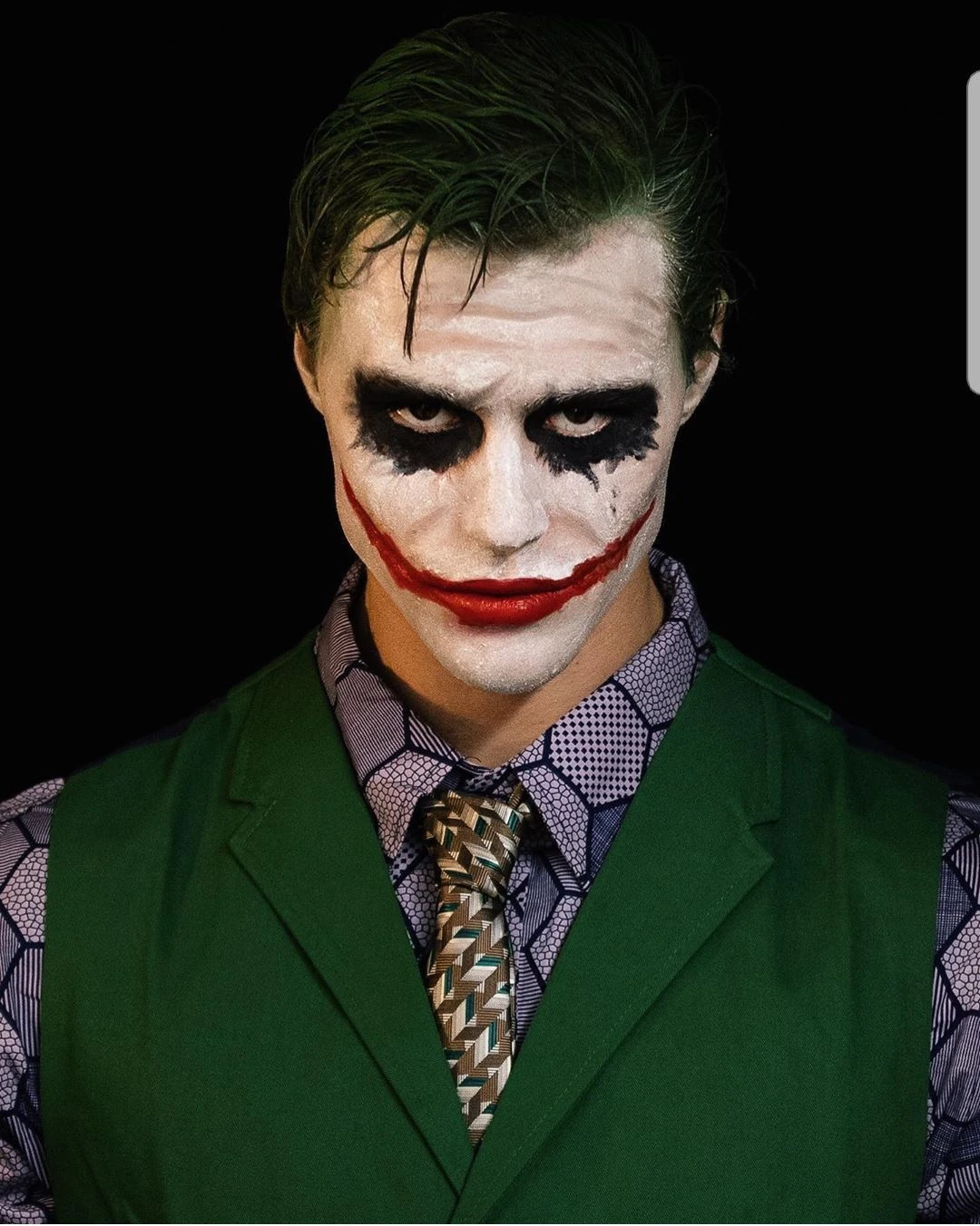 Joker in a green vest