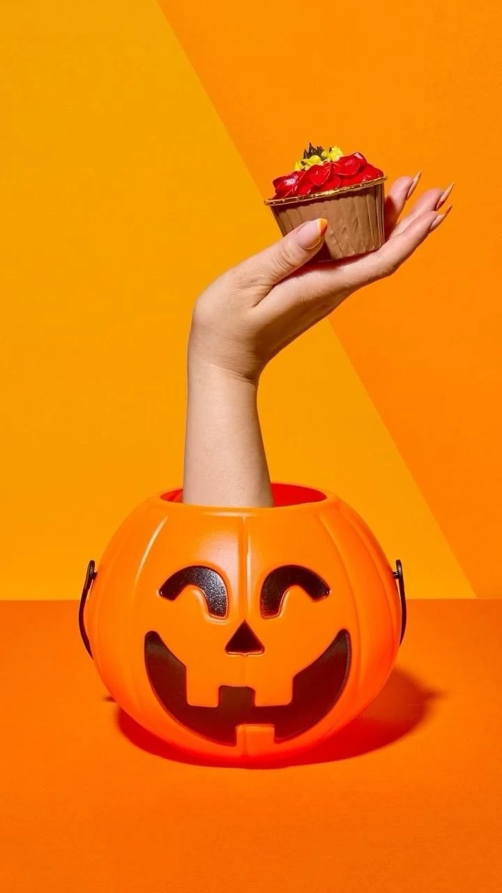 Hand Rising from Pumpkin Bucket